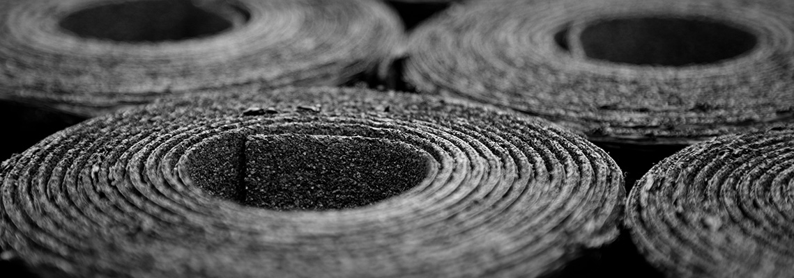 Closeup of felt rolls of new black felt rolls. Selective focus
