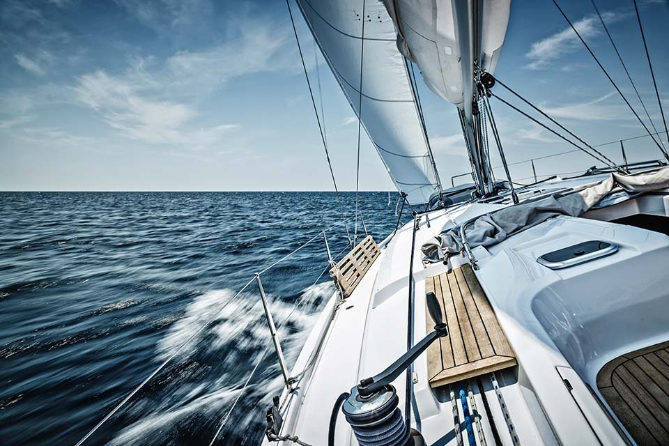 Sailing with a sailboat on the high seas with light winds