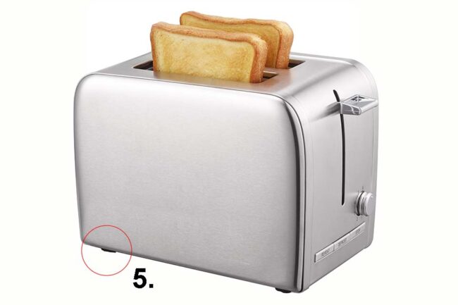 Toaster with toast in silver metal with apparatus feet, isolated on white background