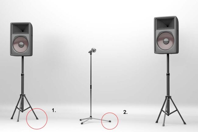 Concert stage equipped with two large speakers and a microphone with stand, glides and protection caps