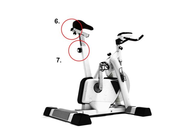Modern exercise bike with protective stoppers and star grip screws for adjusting the saddle height on a white background