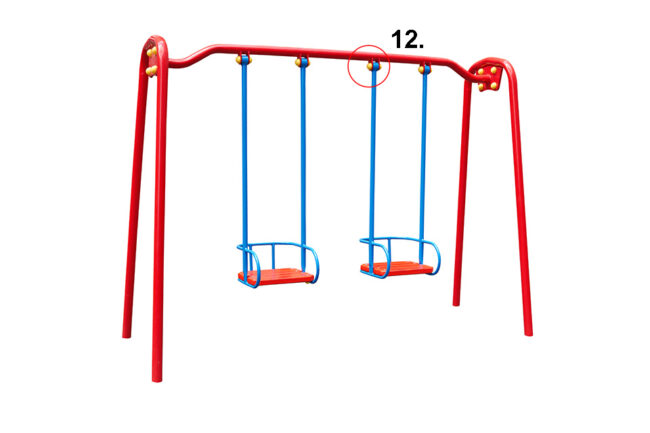 Swing in red for children's playground with protective caps on suspension