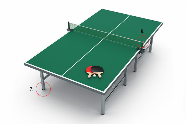 Table tennis table with slatted stoppers on the feet and net on white background